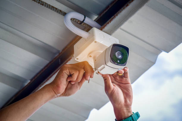 Technician Adjusting Cctv Camera 