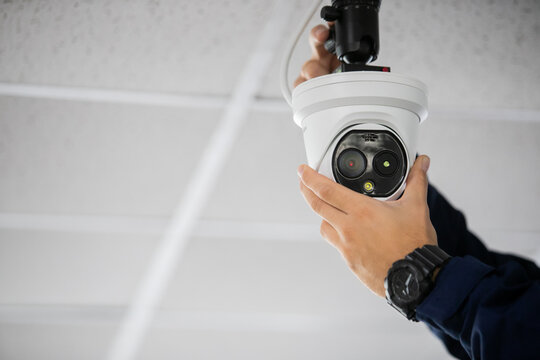 Technician Adjusting Cctv